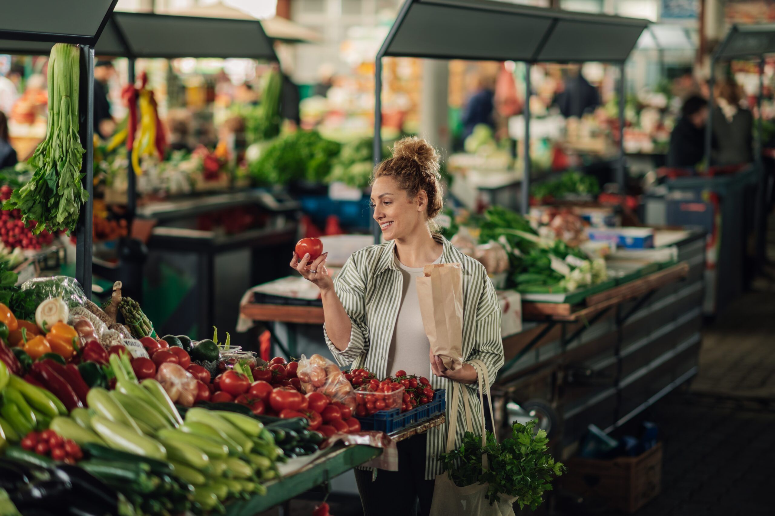 Woman shopping in an outdoor market.