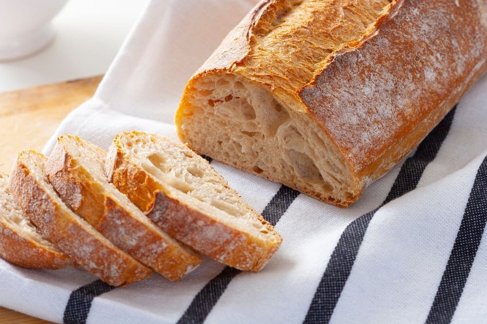 Sourdough bread on a kitchen towel.