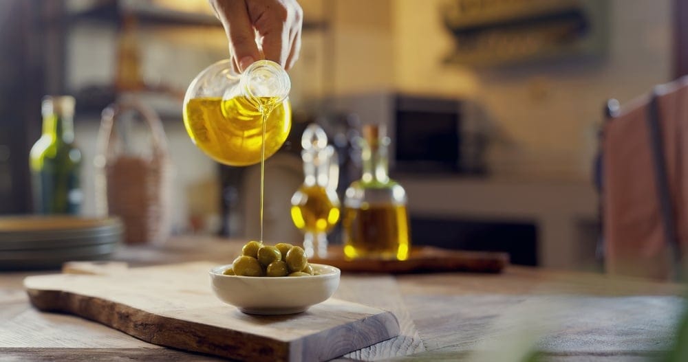 Olive oil with olives.