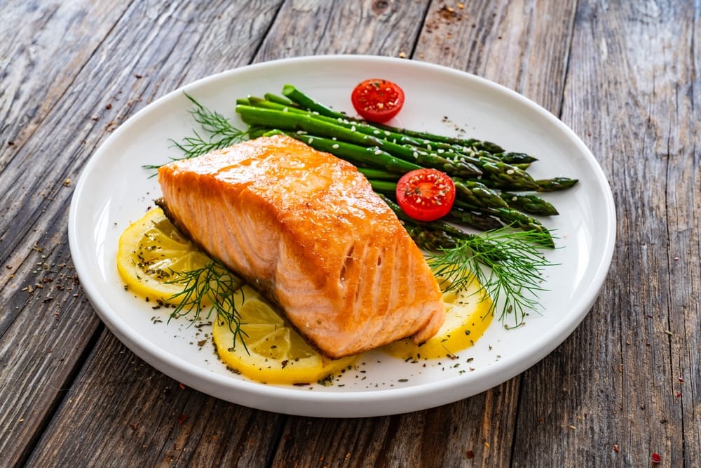 Salmon and asparagus on a plate.