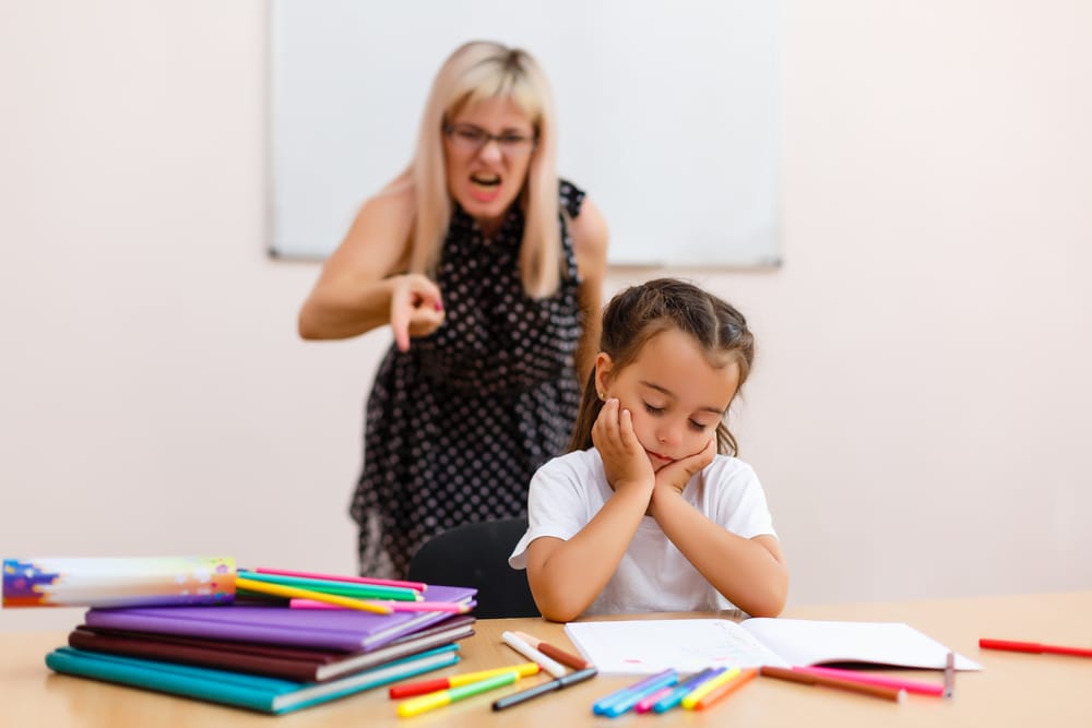 Teacher yelling at a female student.
