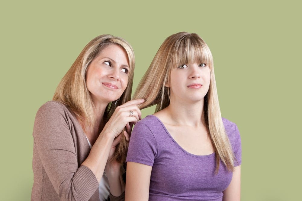 Mother asking her daughter for something.