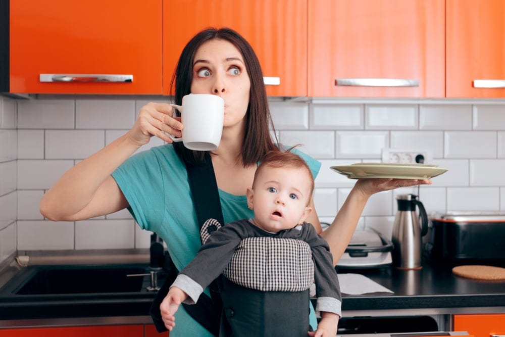 Woman multitasking with baby.