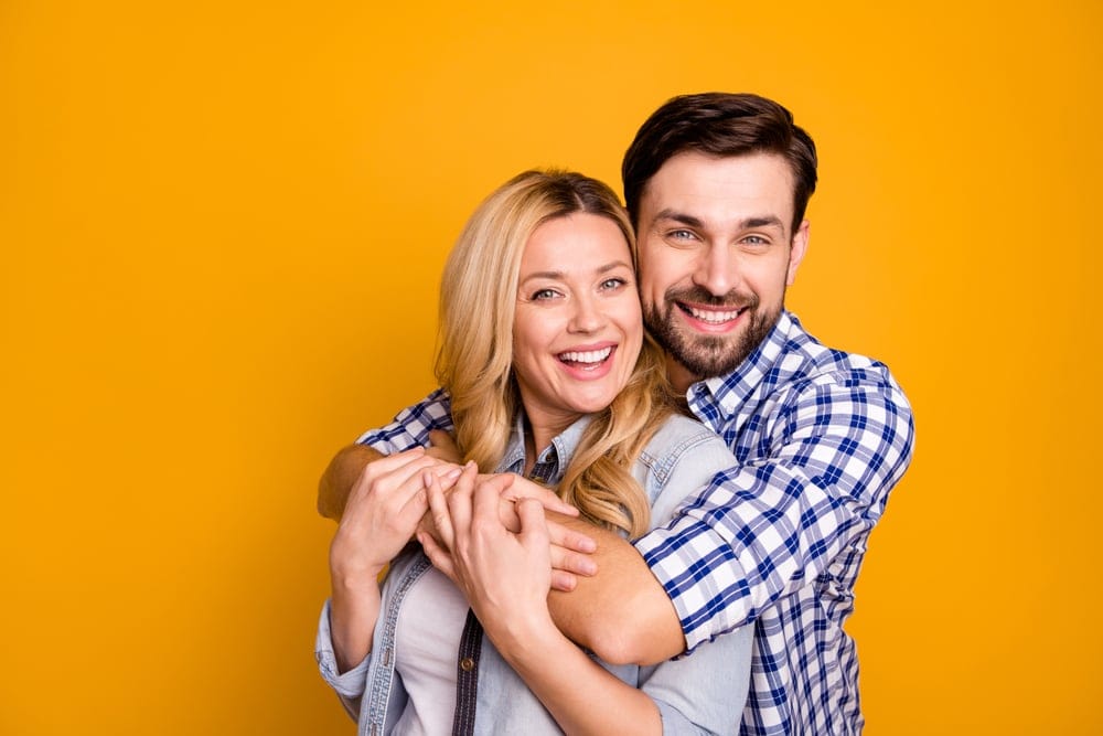 Happy couple embracing.