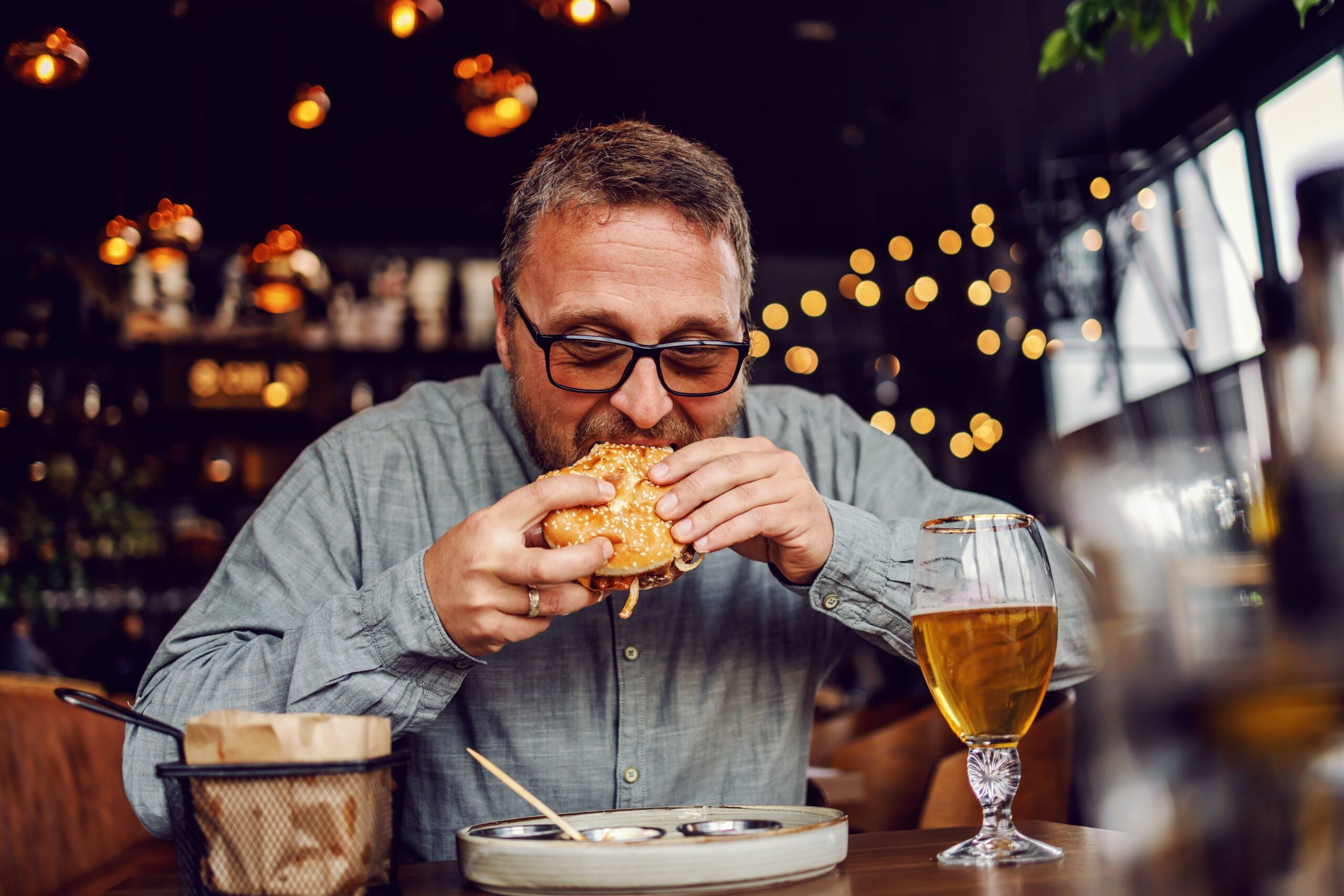 Man eating a hamburger.