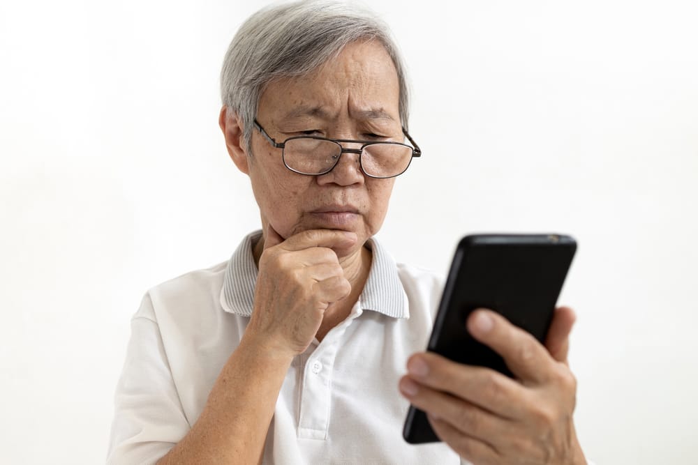 Man looking at his tablet.