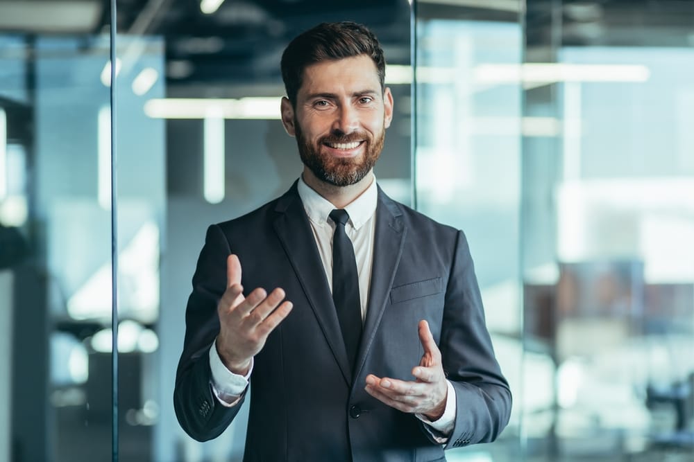 Businessman chatting with coworkers.