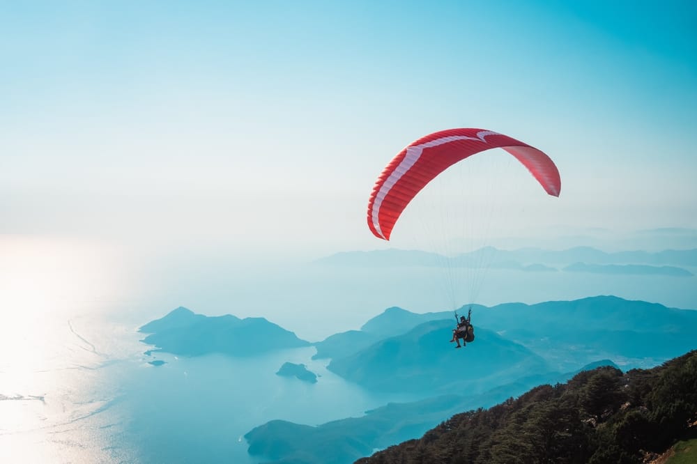 Parasailing in blue skies.