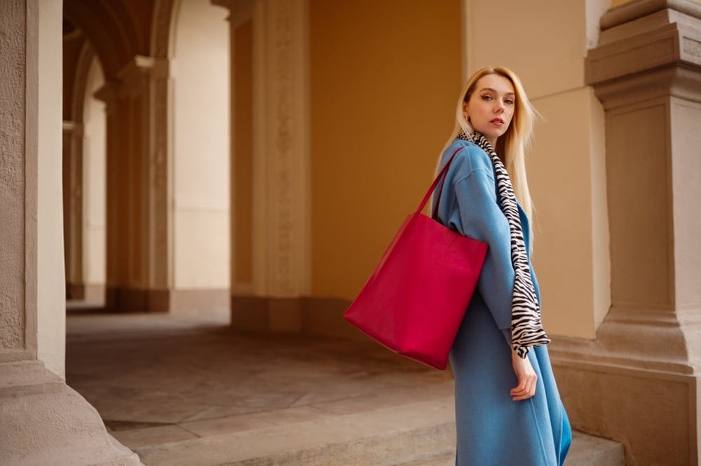 Fashionable woman with a red bag.
