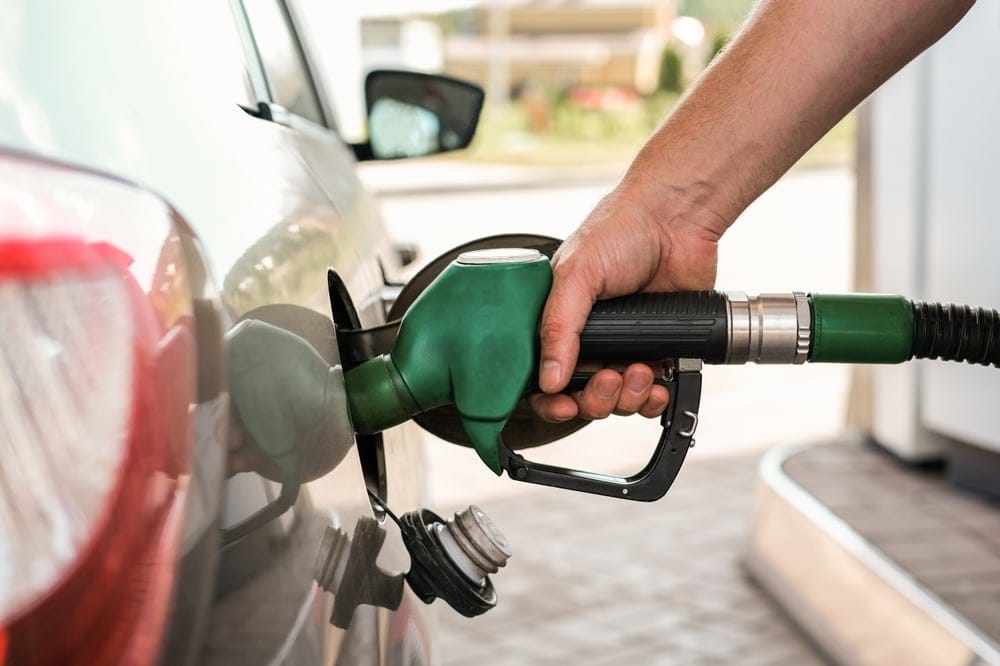 Man filling his gas tank up.