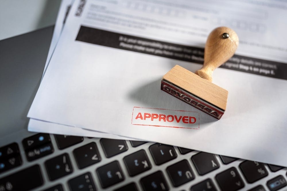 Approved stamp on an application.