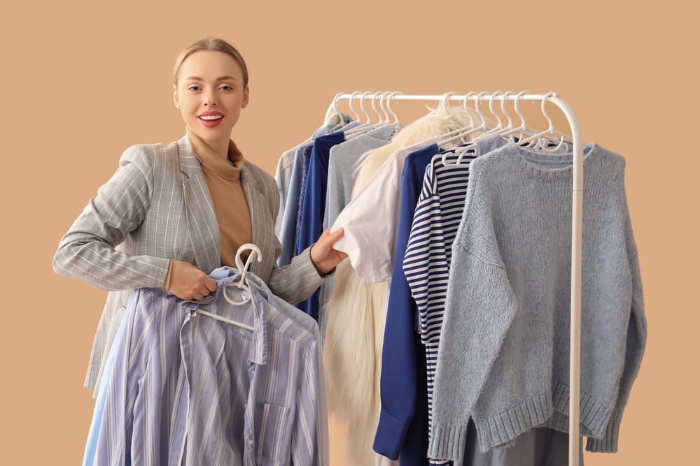 Woman going through her waredrobe.