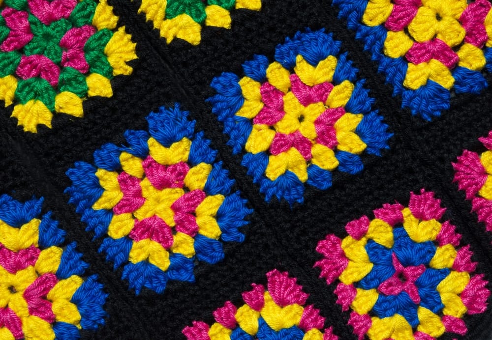 A handmade quilt with a pattern.