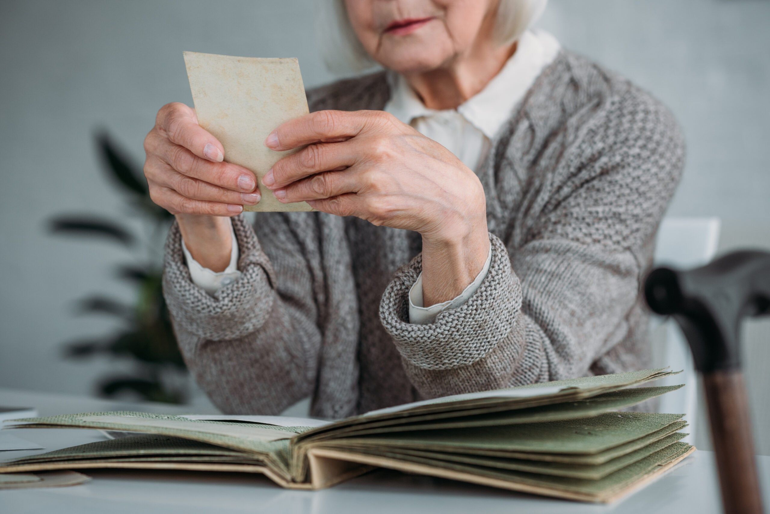Older woman looking at photographs.