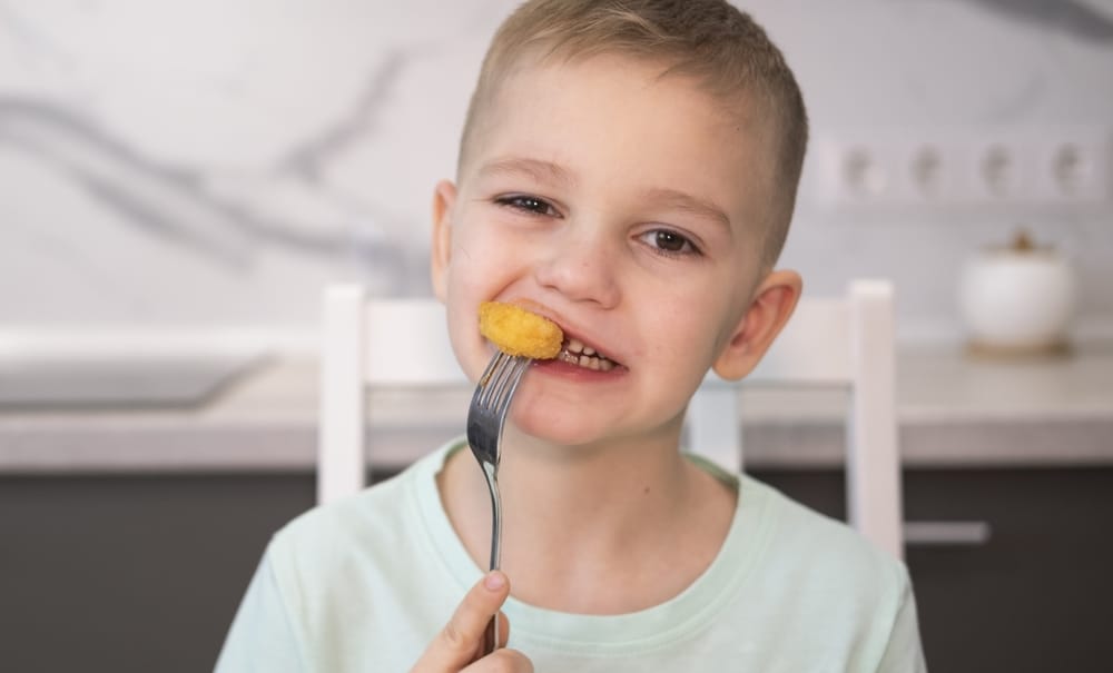 Little boy having a snack.