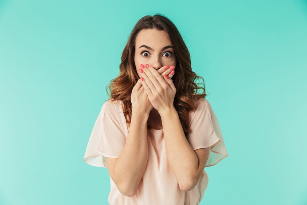 Young woman looking shocked.