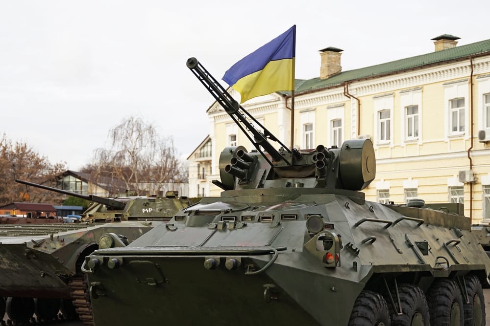 Army troops on a tank.