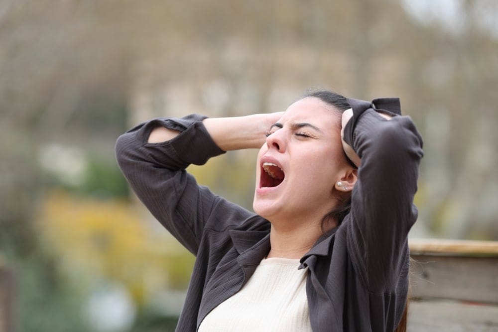 A woman yelling in anger.