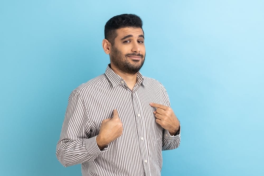 Man pointing to himself.