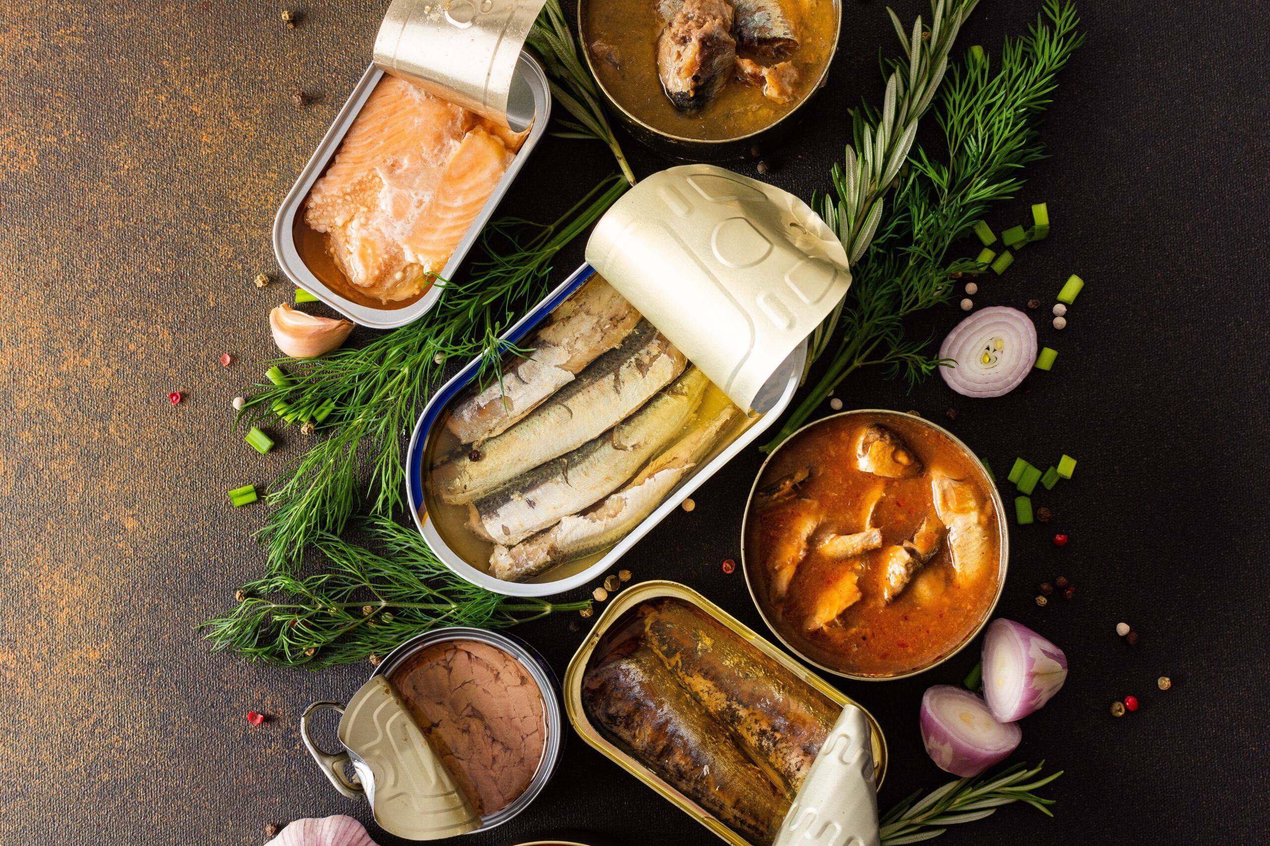 Different tins of fish opened.