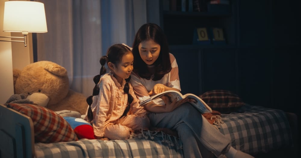 Mother and daughter reading together.