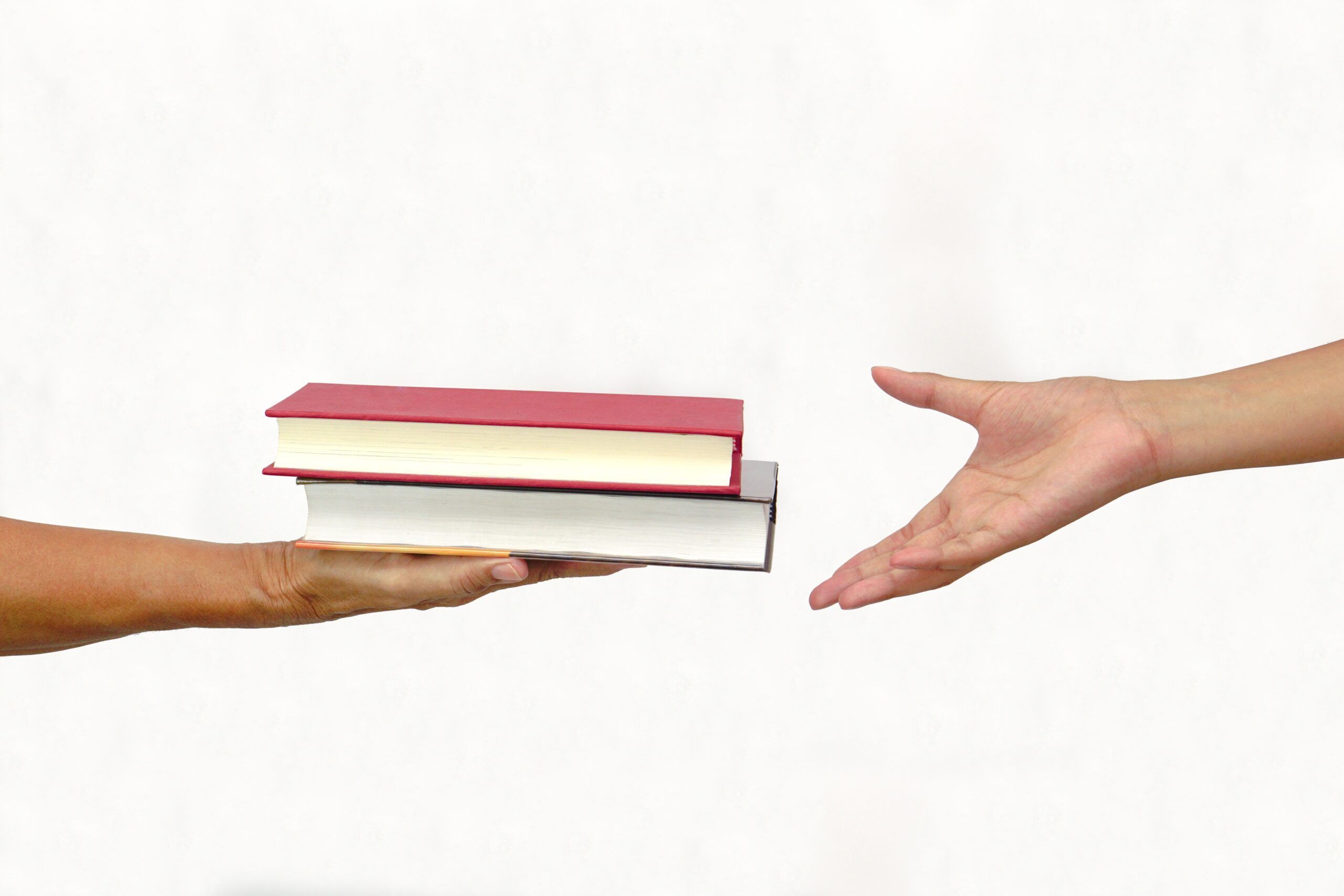 Books handed to one another.