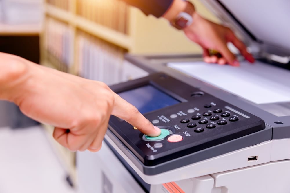Man using a printer.