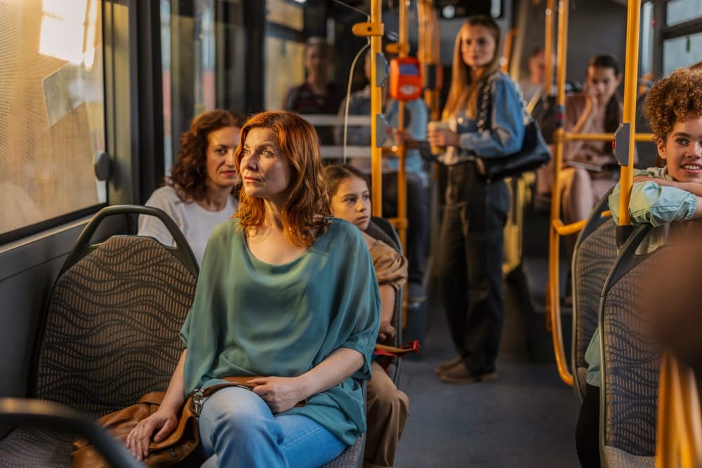 People riding the bus together.