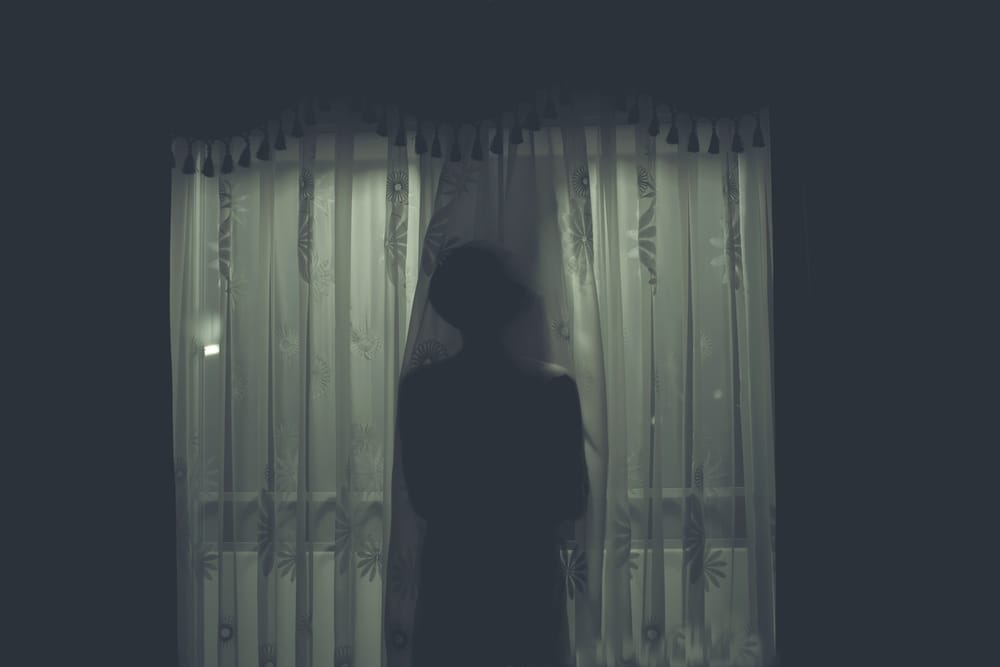 Scary person in the dark.