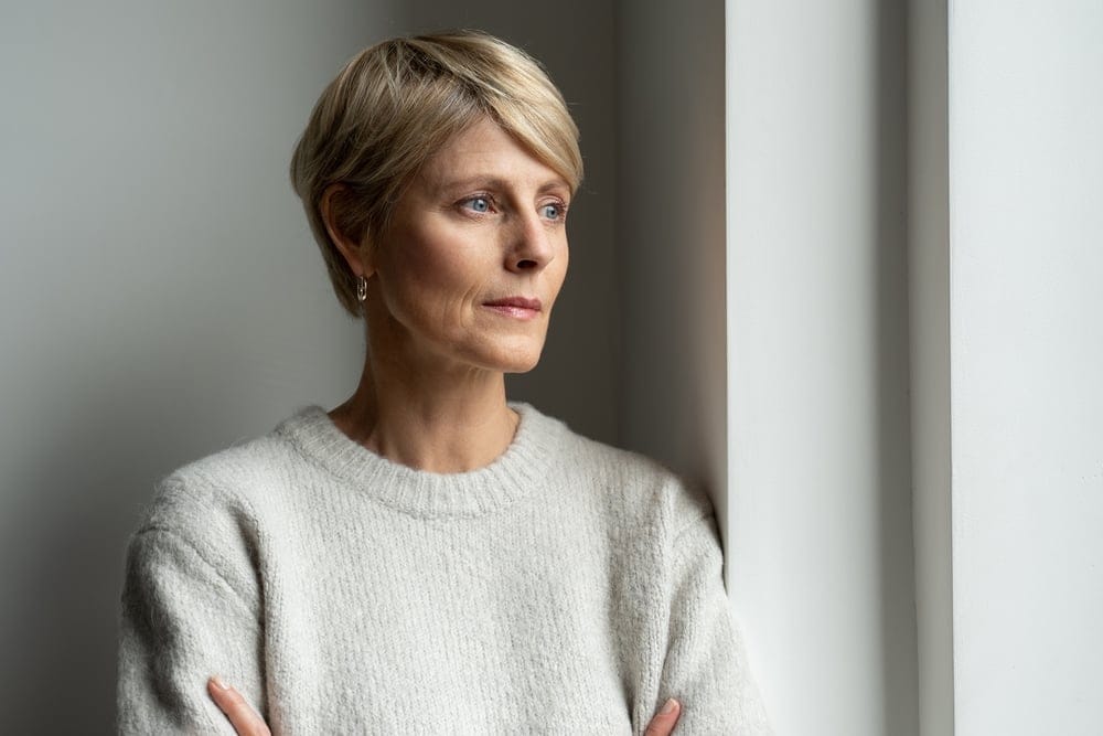 Woman looking sad and thoughtful.