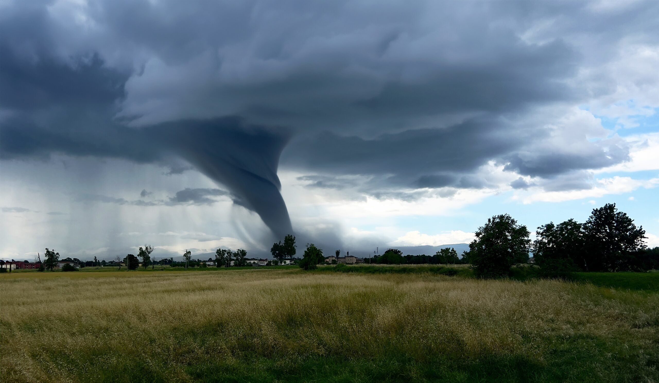 Tornado forming over land.