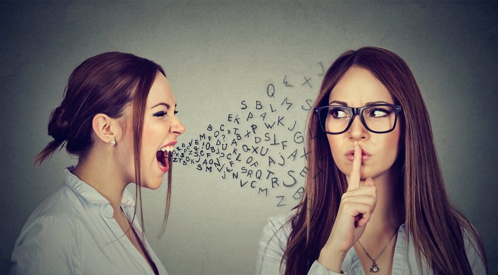 Woman asking another woman to be quiet.