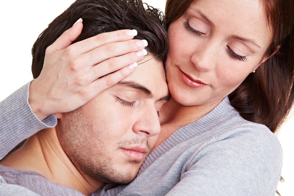 Woman trying to console her boyfriend.
