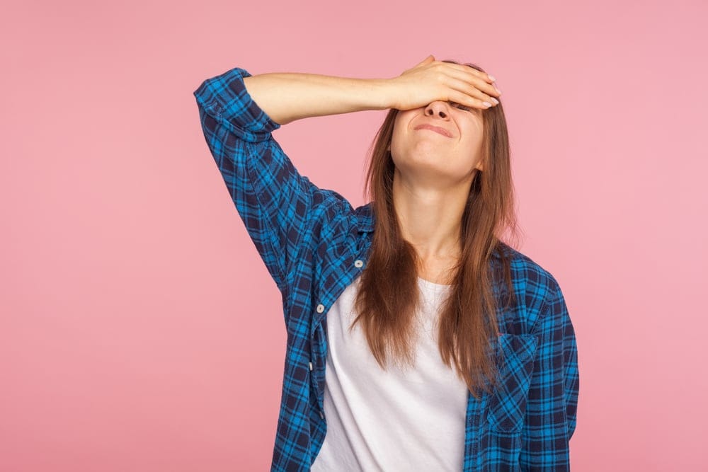 Woman frustrated that she can't concentrate.