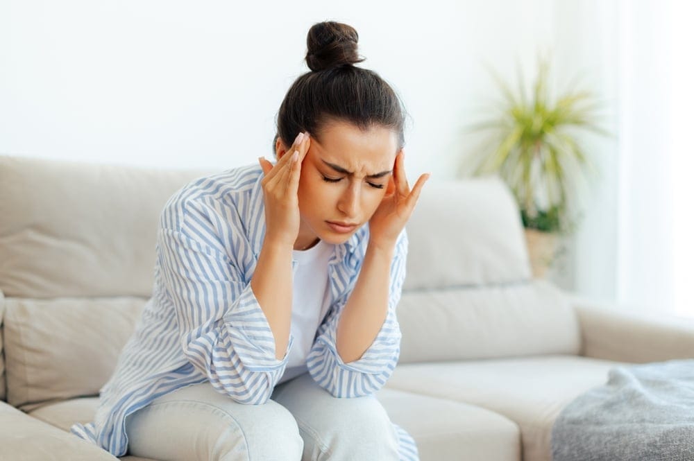 Woman with a tension headache.
