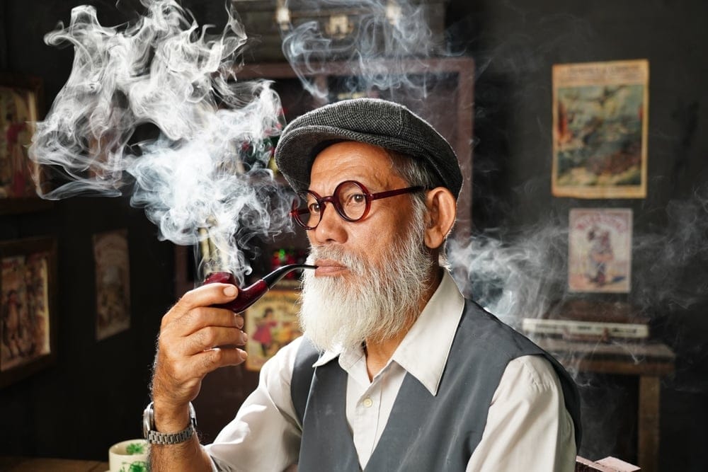 Man smoking a pipe.