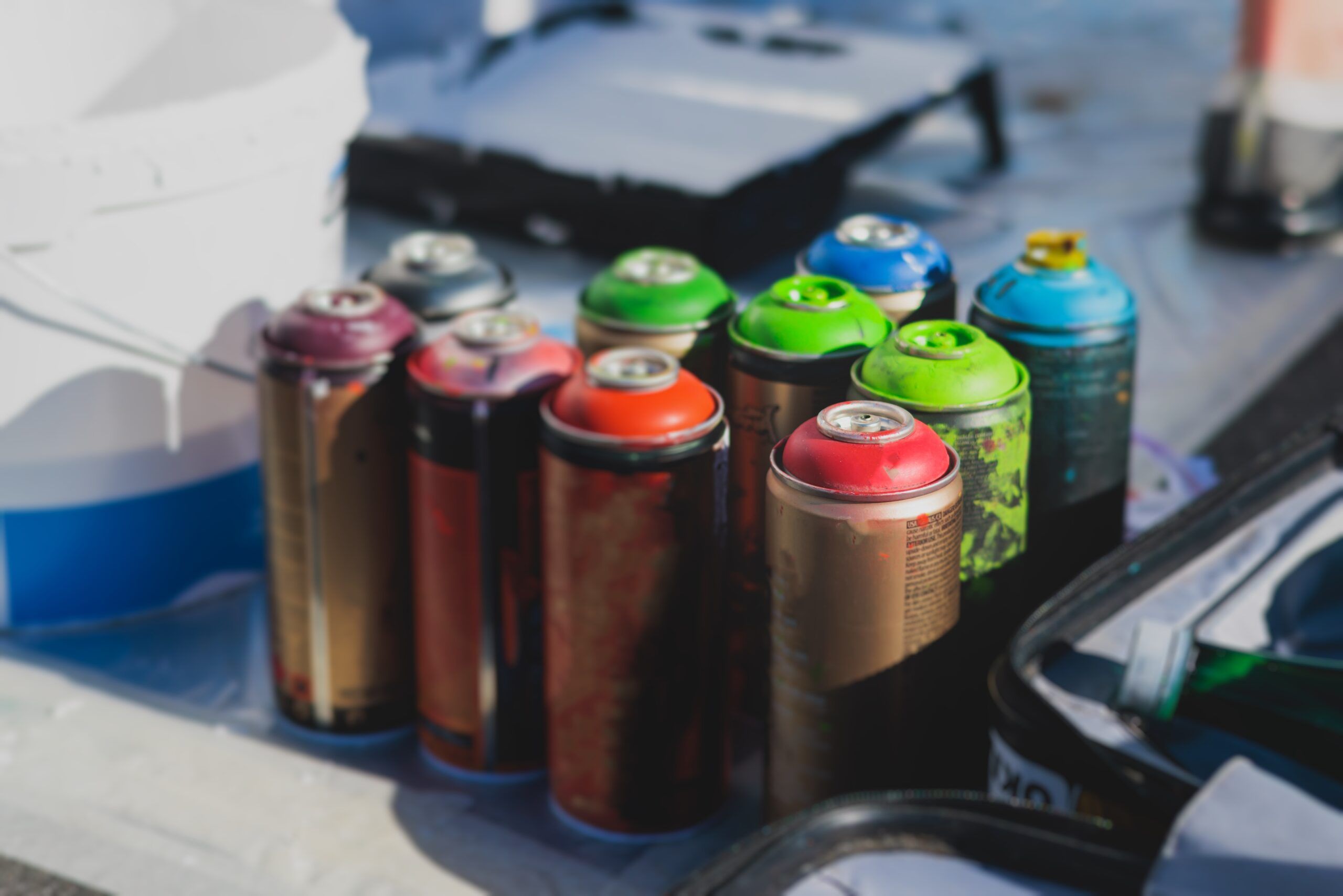 Cans of aerosol spray paint.