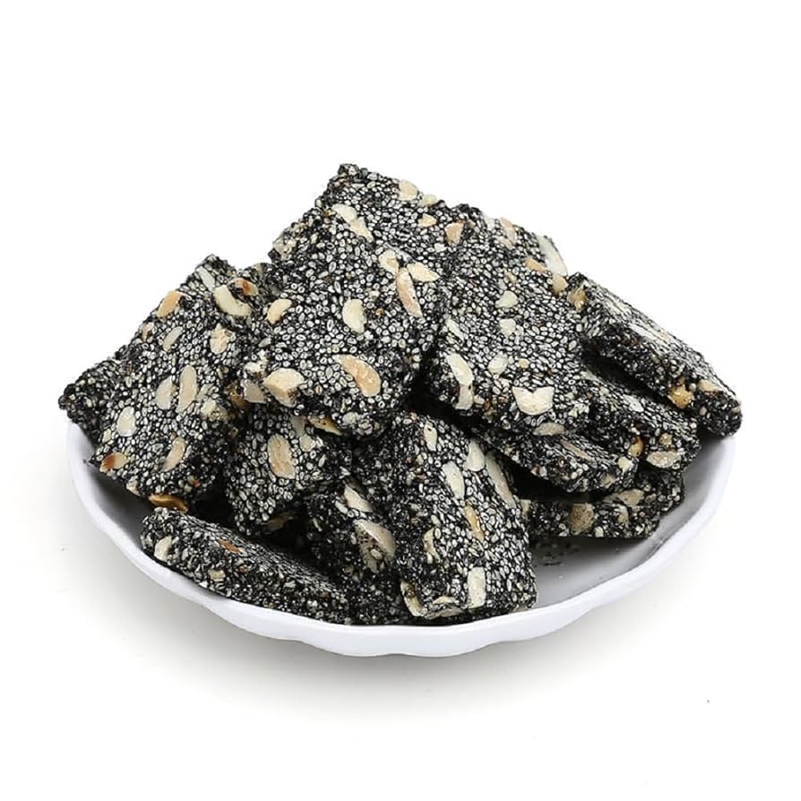 Black sesame candy on a plate.