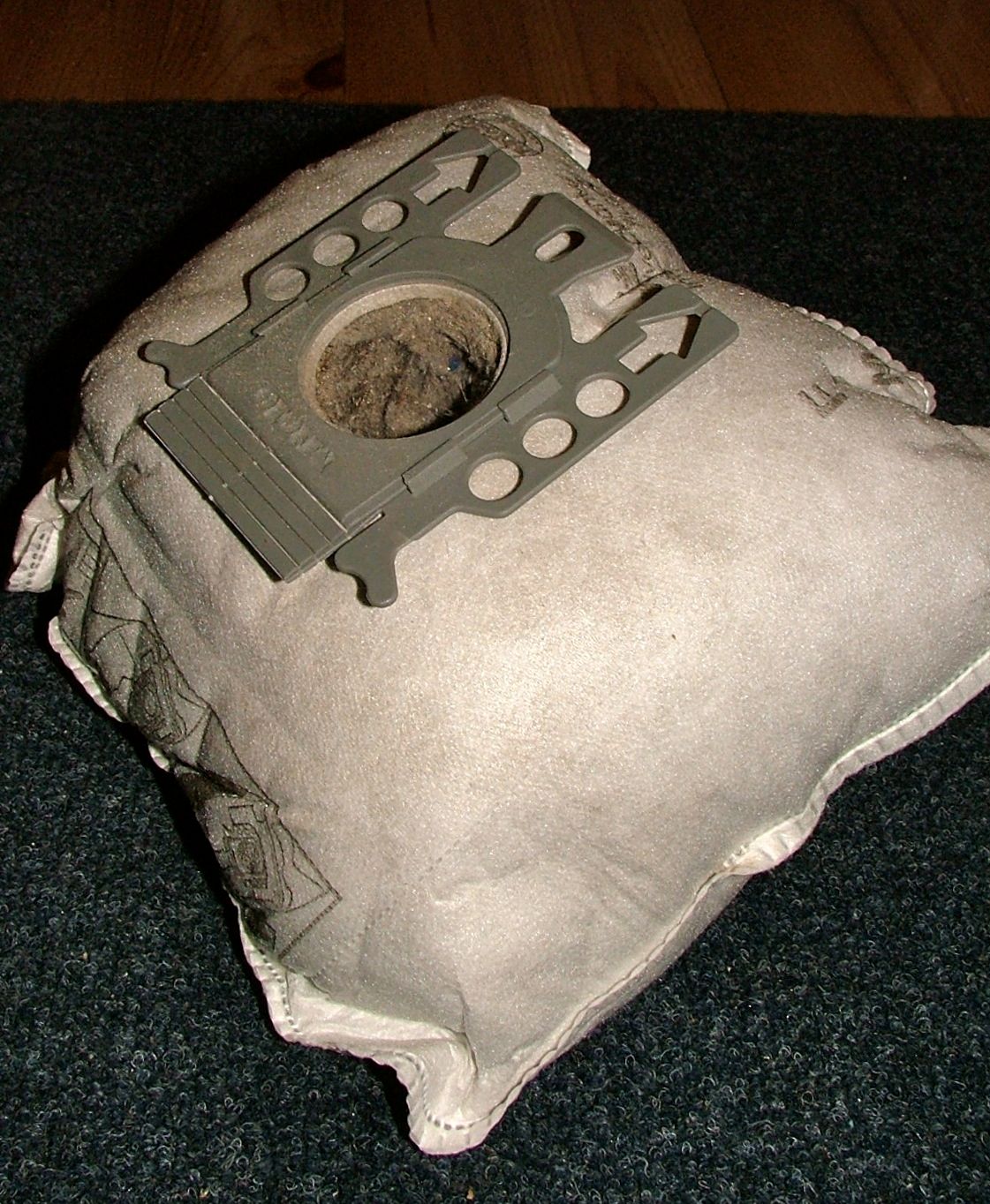 A full vacuum cleaner bag.