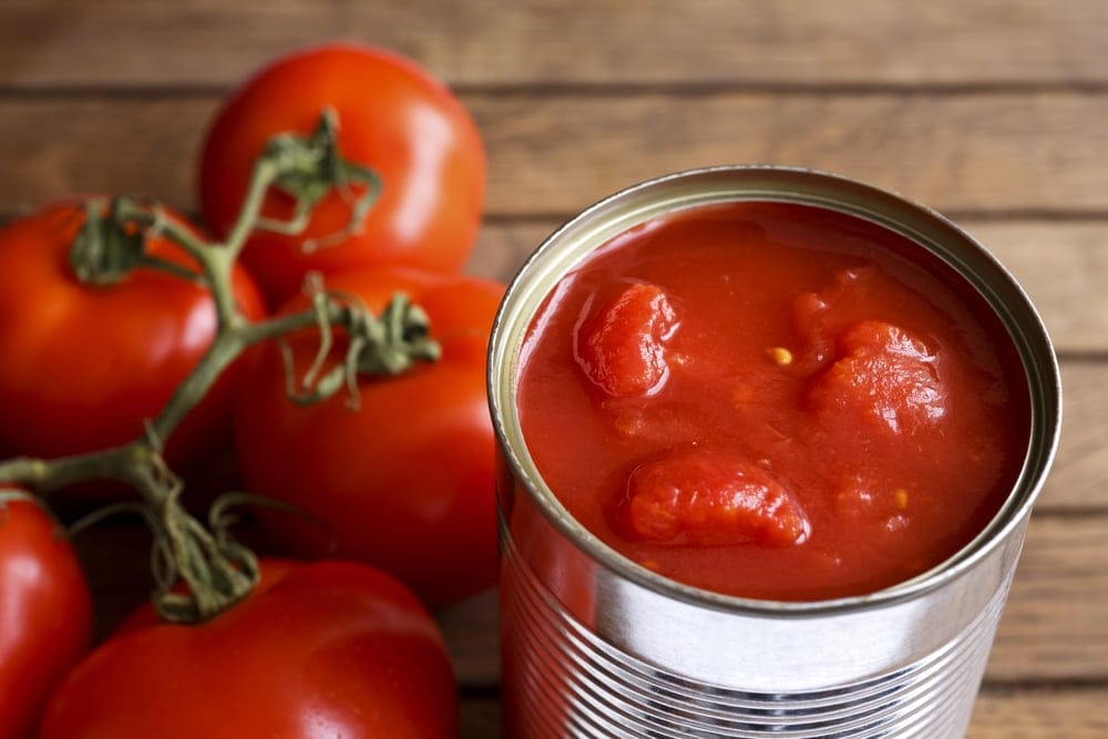 Open tin of canned tomatoes.