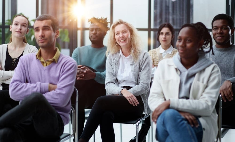 A group of employees undergoing mandatory business training