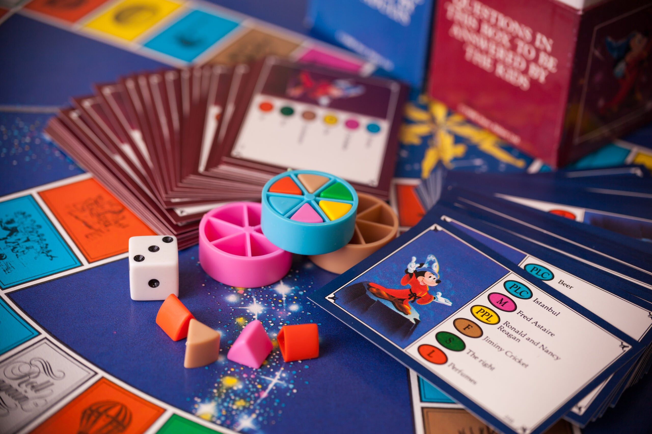 Adults having a Trivial Pursuit board game night.