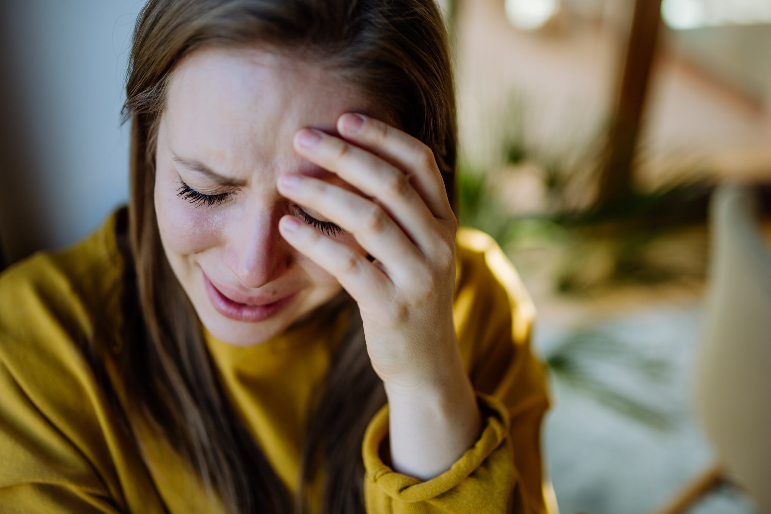 A woman trying to stop thinking about a break-up.