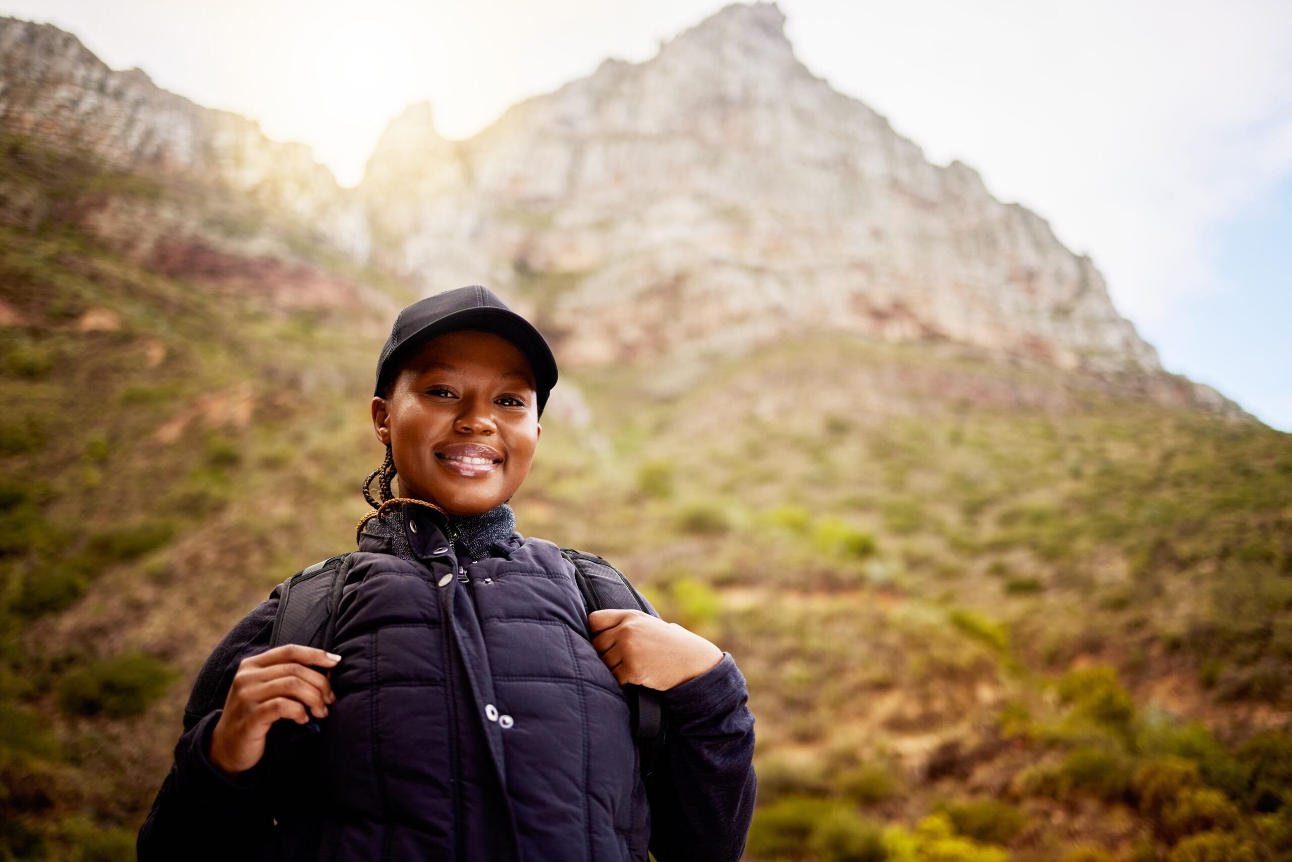 Woman enjoying a solo hike in the mountains.
