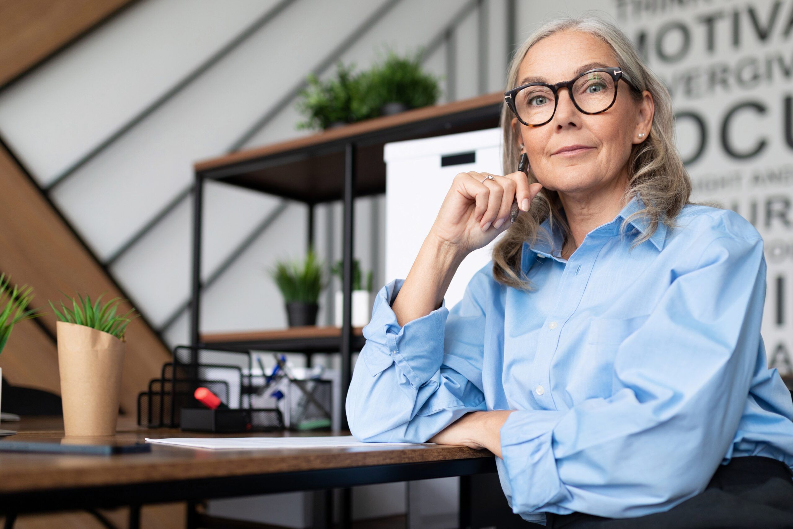A mature businesswoman in her office.