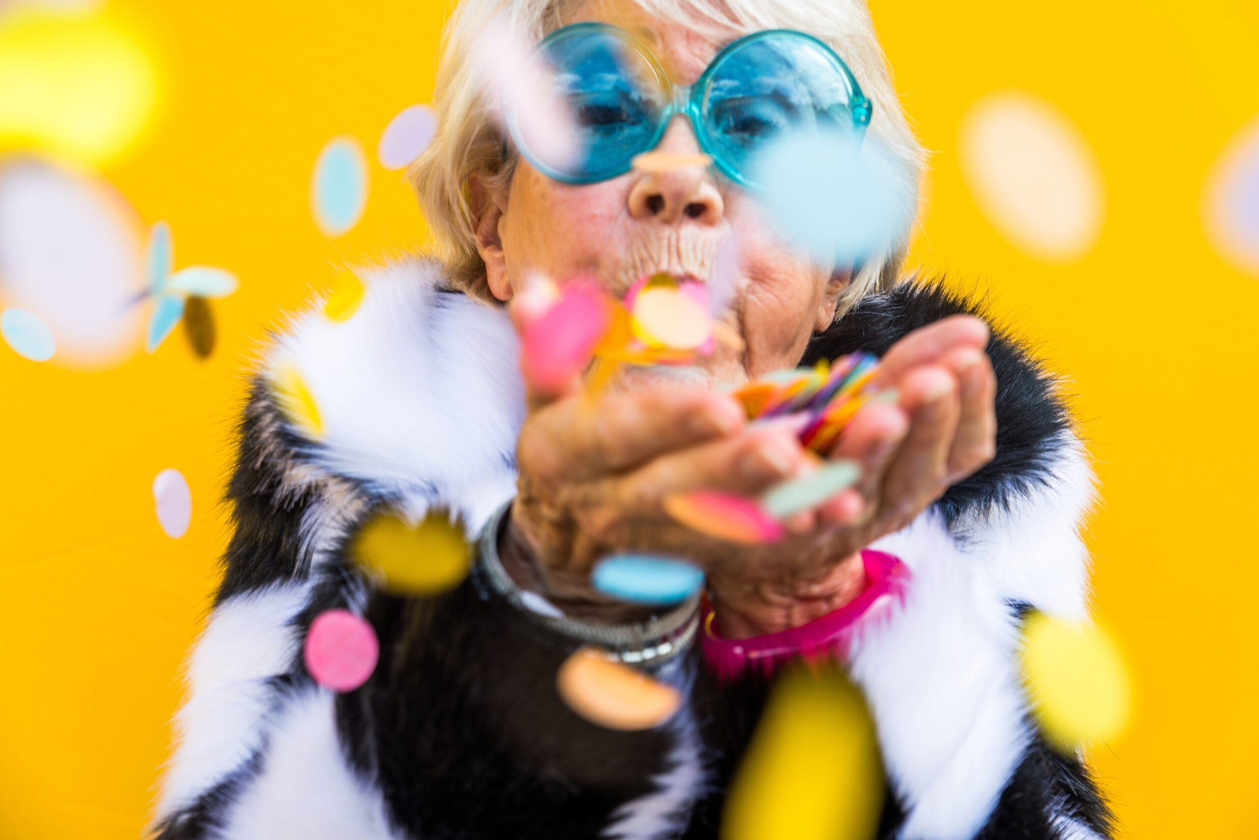 A resilient and happy mature woman enjoying a celebration.