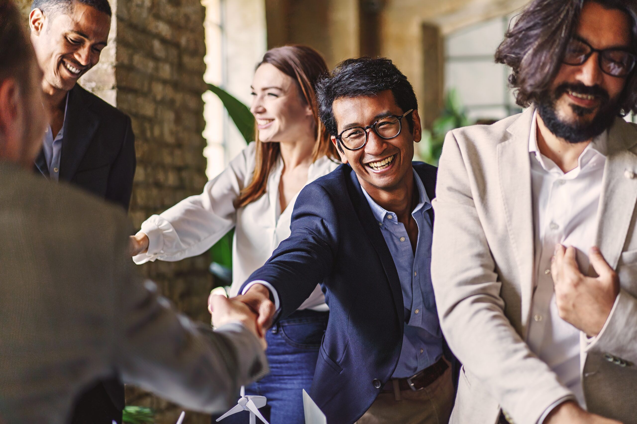 A group of people engaging in small talk at a networking event.