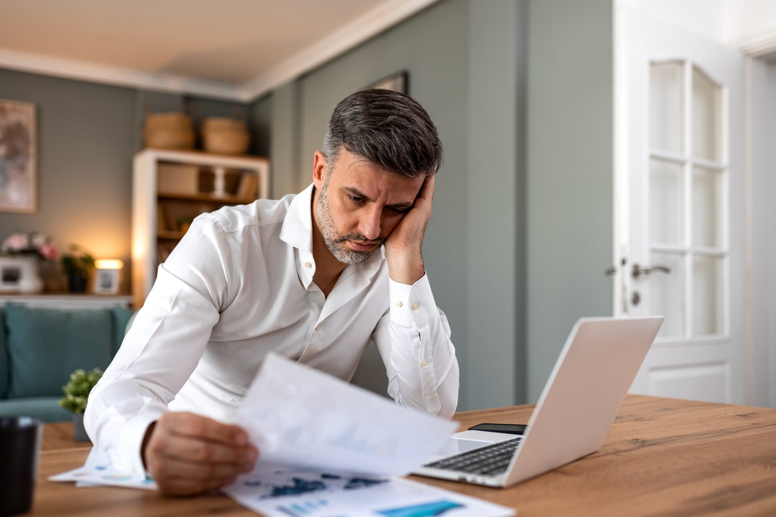 A successful businessman feeling lonely while working.