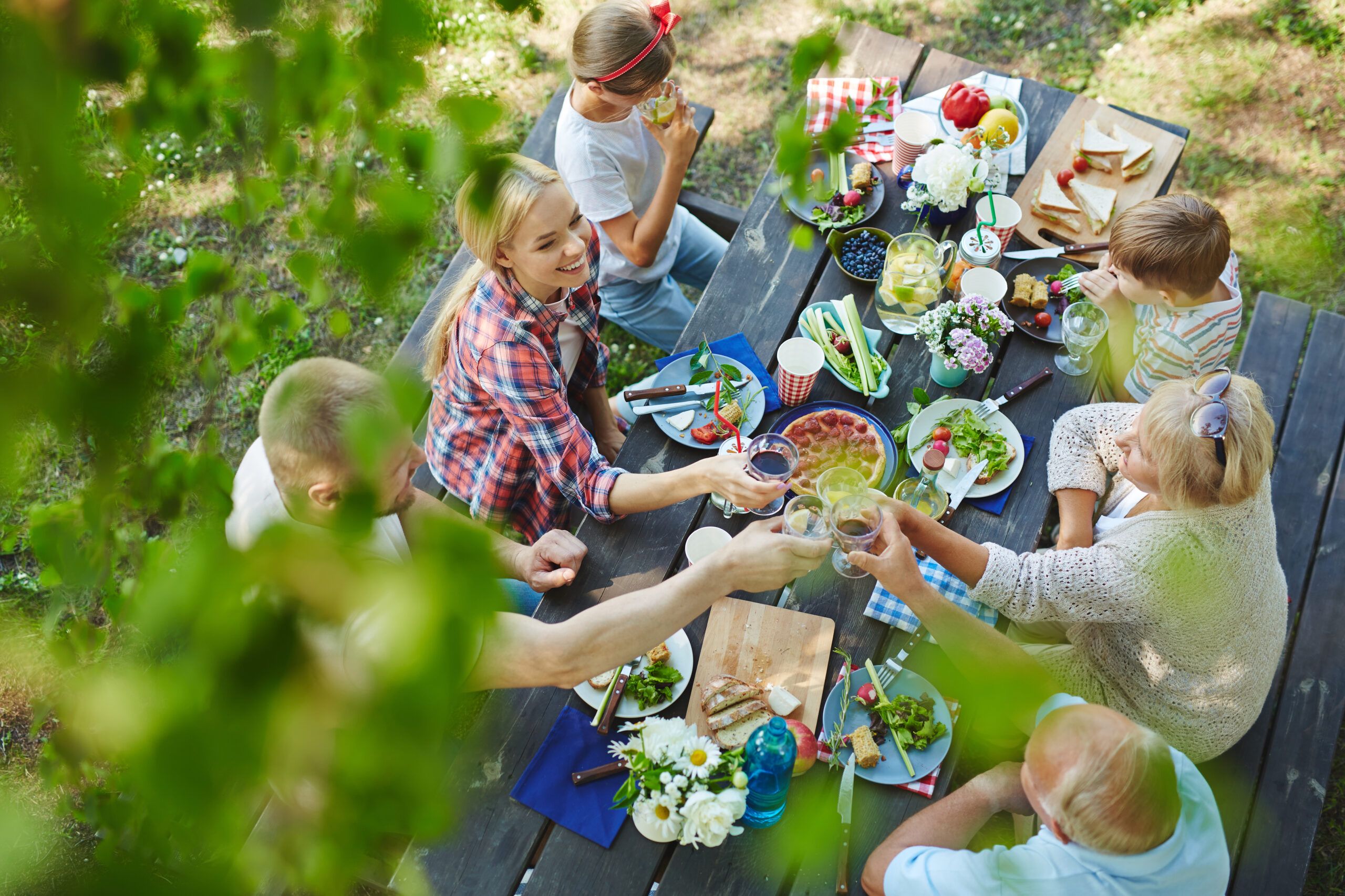 A beautiful and raucous family dinner outside.