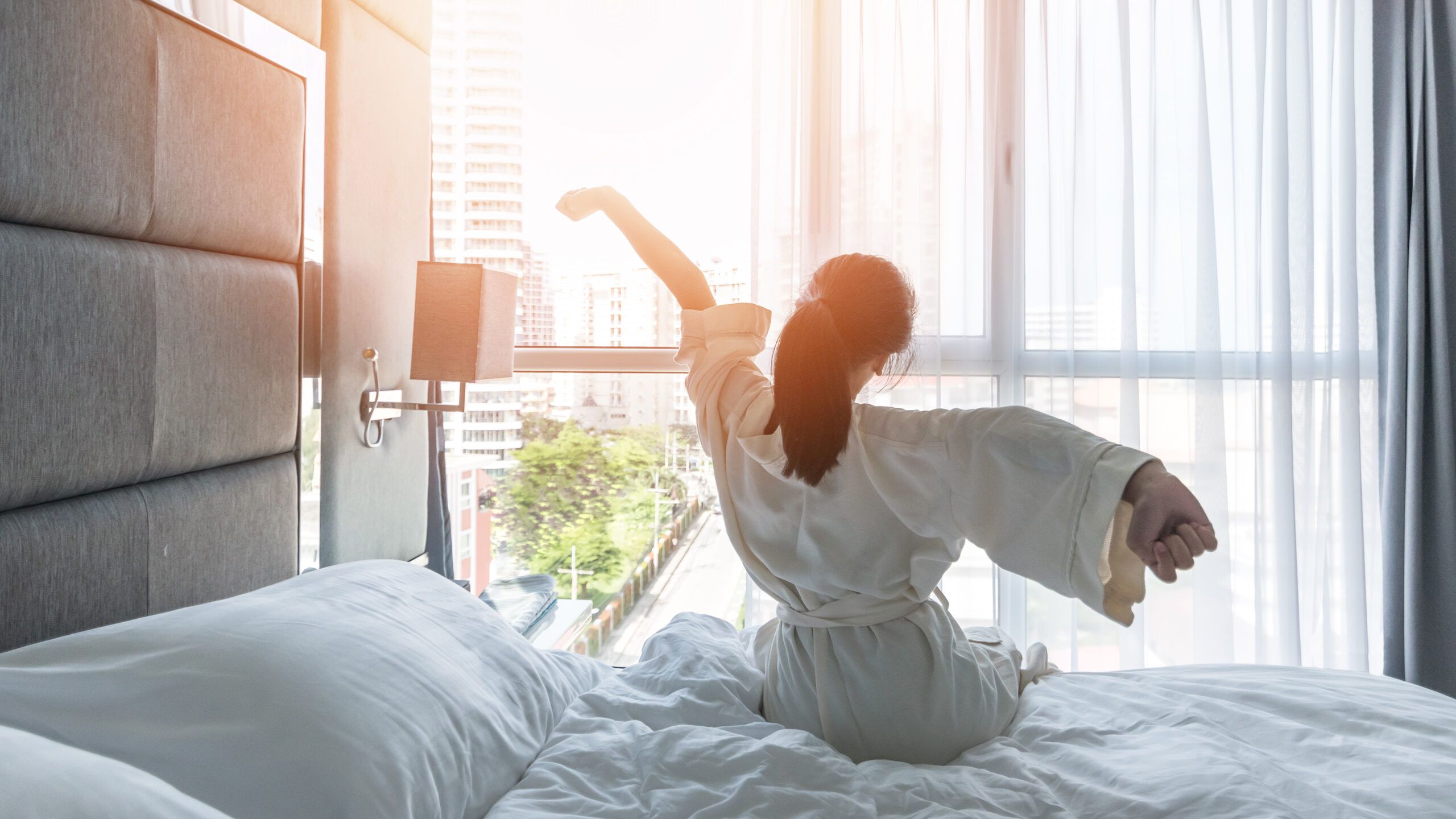 Woman waking up after a great night's sleep.